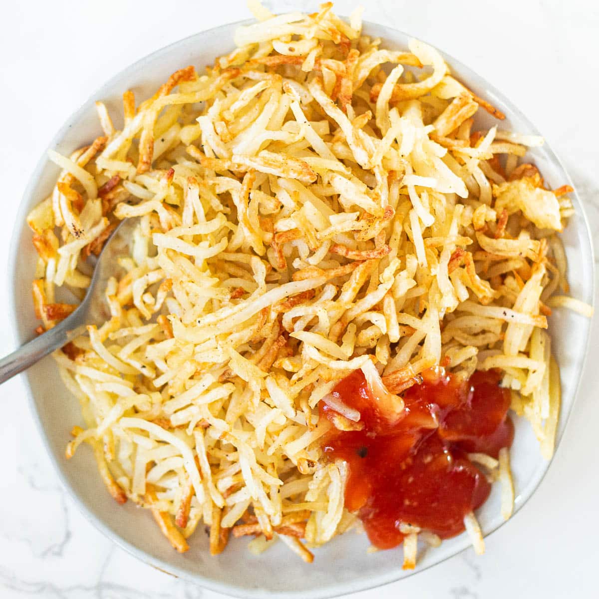 Papas hash browns en freidora de aire